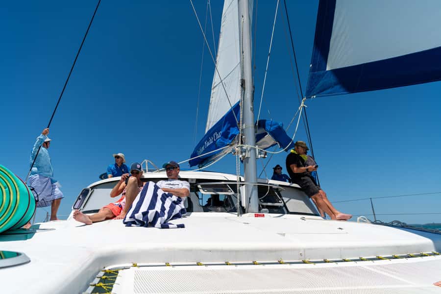 Brisbane: Half-Day Moreton Bay Sailing Cruise with Antipasto - The anchorage fun: paddleboards, giant aqua mat, and beach games
