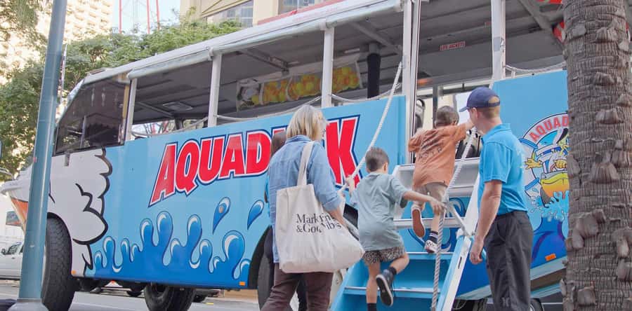 Gold Coast: 1-Hour Land and Water Duck Tour - Kids steering the Aquaduck, the captain’s certificate moment