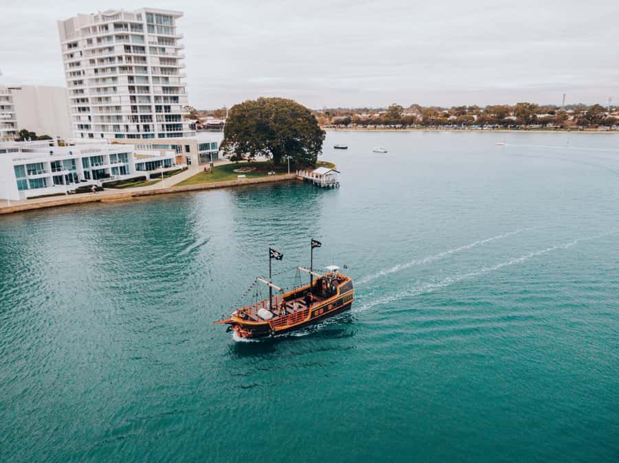 Mandurah Pirate Cruise - What kids do on board: wheel, telescopes, and cannon time