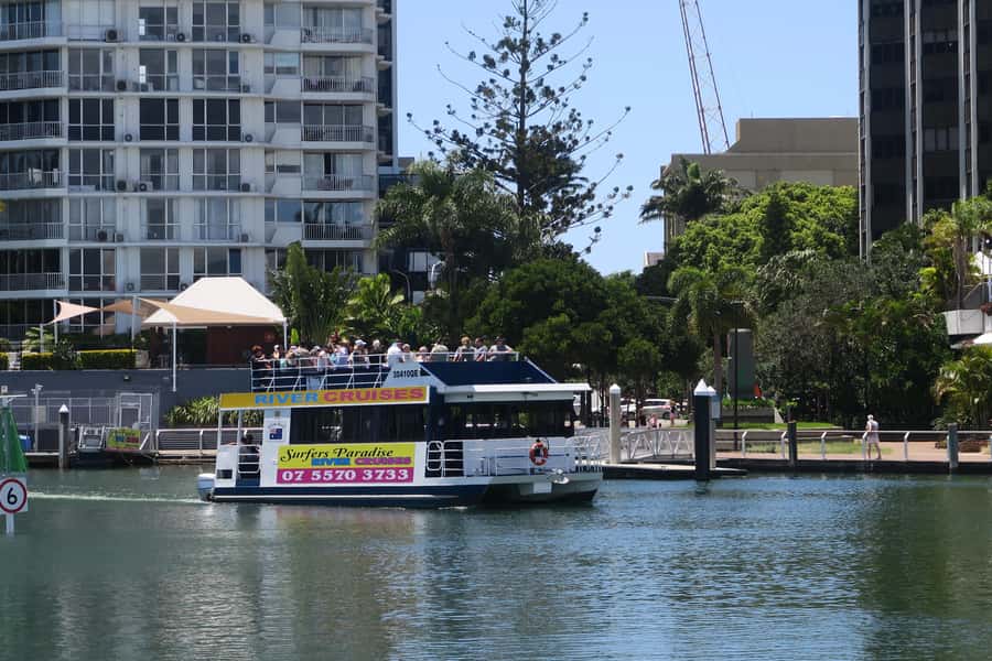 Surfers Paradise: Sightseeing Midday River and Canal Cruise - Gold Coast views beyond Surfers Paradise: yachts, skyline, and waterfront homes
